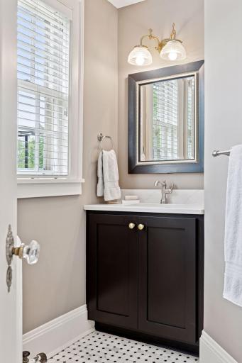 Sleek tile work, modern fixtures, and elegant lighting come together to create a polished retreat.