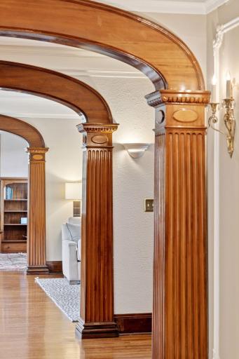 A closer look at the standout feature of the grand wood archways and columns on the main level.
