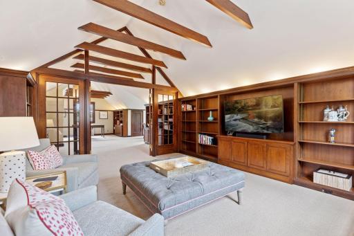 Touches of storybook charm and timeless appeal throughout the third level from pitched ceiling, exposed ceiling beams, natural woodwork and classic built-ins.