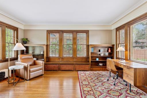 This office space features custom built-in shelving providing ample space for books, dÃ©cor and organization and the built-in bench beneath the windows offers a charming spot to read, reflect, or simply enjoy the view.