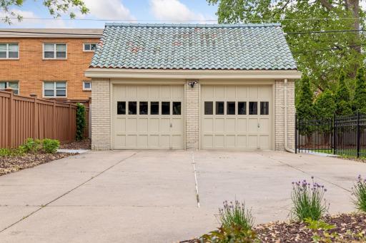 Enjoy the convenience of a long private concrete driveway leading to the rear two-car garage.