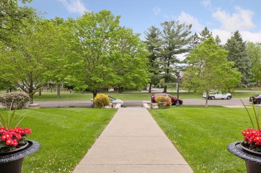 The beautifully maintained front yard features new landscaping, complete with neat stone edging and widened sidewalk!