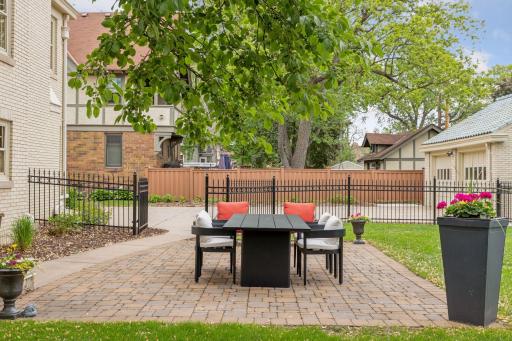 Step into a beautifully landscaped backyard that offers both space and serenity. The paver patio provides the perfect setting for outdoor dining and entertaining. The yard offers a sense of privacy while still feeling open and inviting.
