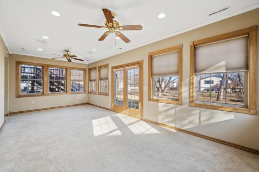 Spacious sunroom on the main level that walks out to the backyard.