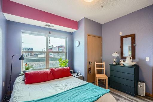 The second floor, east-facing windows illuminate the primary bedroom.