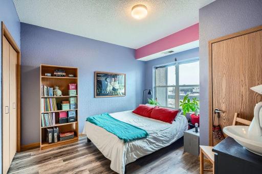Spacious primary bedroom with generous closet storage.