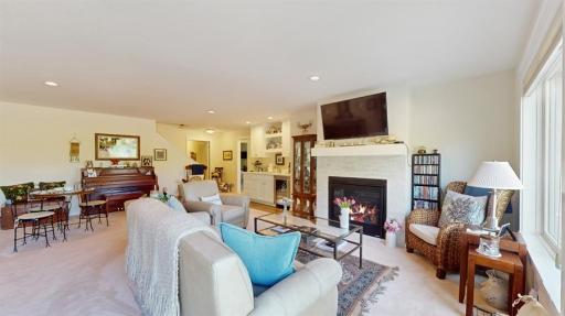 Lower level family room also features cozy gas fireplace