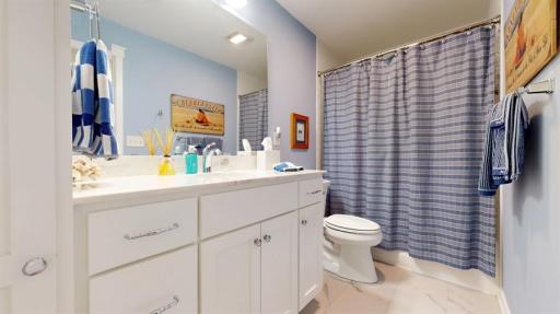 Full bathroom separates both lower level bedrooms