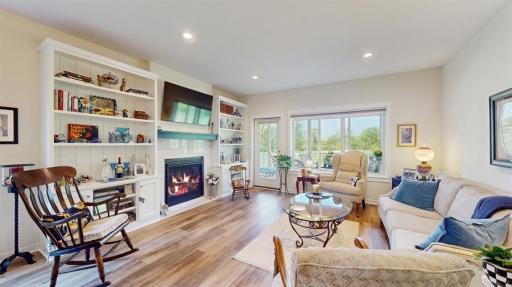 Beautiful built-ins surround gas fireplace in main living area