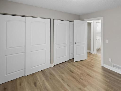 This alternate view of the bedroom shows extra storage.