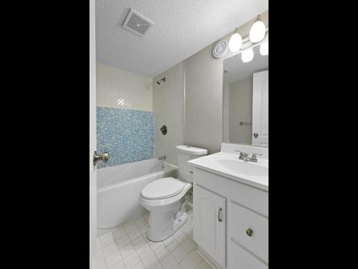 This lower level bathroom may be simple but the tile work add a touch of charm and uniqueness to the space.