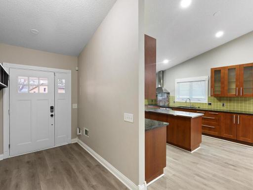 Step inside to find a welcoming foyer that opens to a bright and airy living space