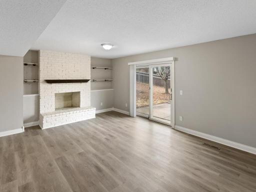 The lower level family room walks out to the backyard patio.