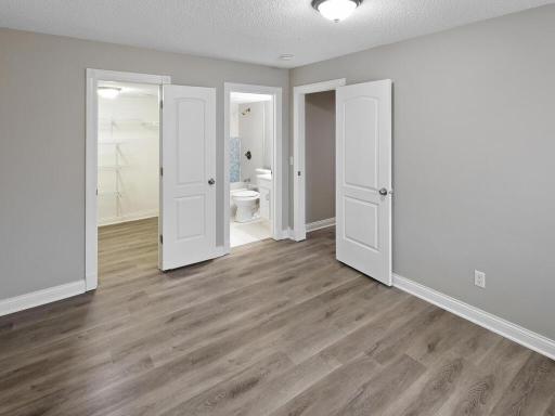 This lower-level bedroom is complimented by a walk in closet and a private full bath.