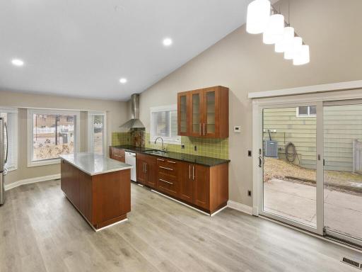 Designed for both style and function, this open kitchen is bathed in natural light, with multiple windows that bring the outdoor in.