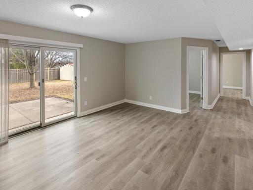 This alternate view from the family room displays the layout of the lower level.