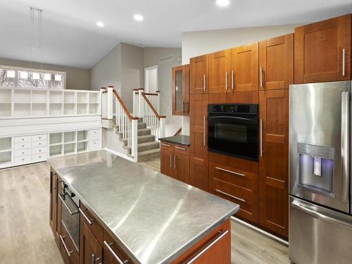 A custom built wall of drawers and cubicles enhances the dining room, providing either storage or a display for keepsakes and decor.