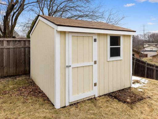 The backyard storage shed provides ample space for all your storage needs.
