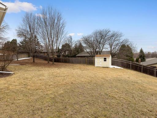 Alternate backyard view shows the expansive fenced backyard.