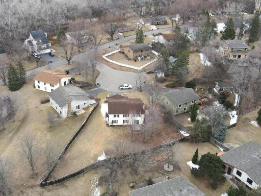 This aerial view captures the home's position in the neighborhood and the layout of the yard.