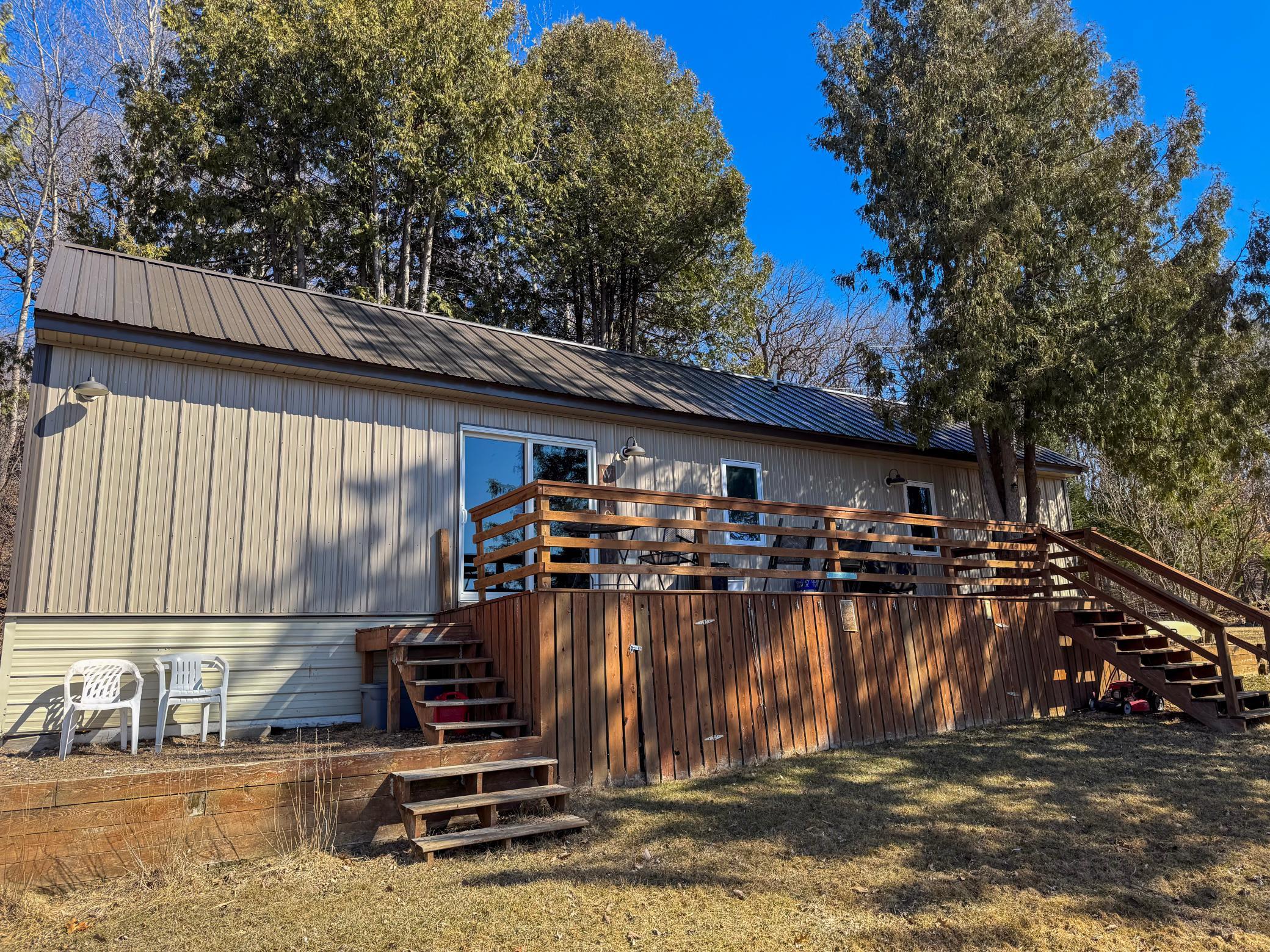 Back of house with deck