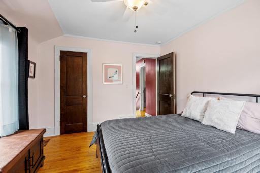 This angle showcases the room's layout, highlighting closet space, rich trim, and stylish simplicity for a move-in-ready feel.