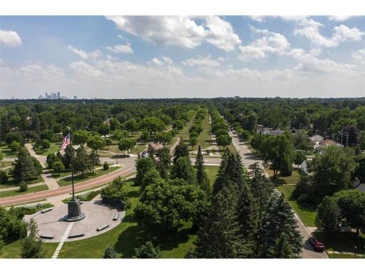 This breathtaking aerial view captures the grandeur of Victory Memorial Parkwayâlined with trees, historic charm, and a vibrant community atmosphere.