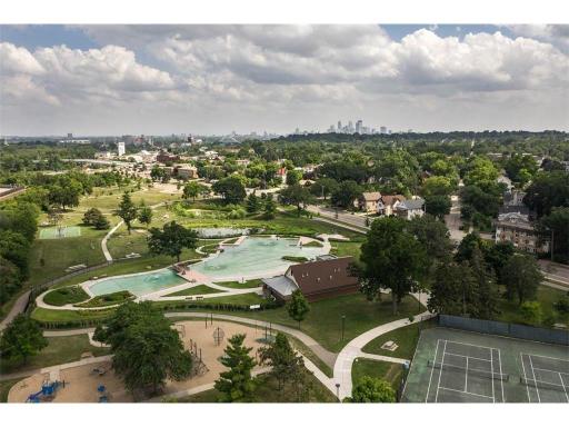 Aerial view of Webber Park showcases the natural swimming pool, green space, tennis courts, and playgrounds for all-season recreation.