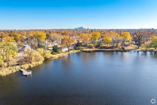 Enjoy serene lakeside views and natural beauty, with downtown Minneapolis visible in the distance for the perfect balance of nature and city access.