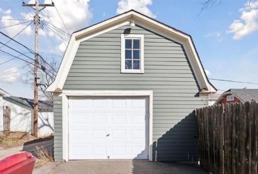 This oversized 1-stall garage features a distinctive Gambrel roof and an upper-level loftâperfect for additional storage, a workshop, or future creative space.