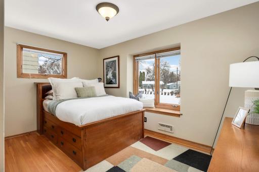 Bedroom #2 with hardwood floors and picture window with ledge