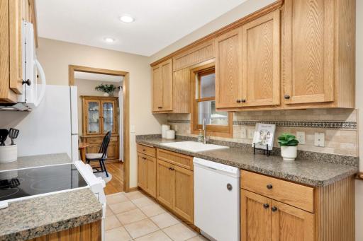 Nice deep kitchen sink with disposal. Nice Hunter Douglas window treatments