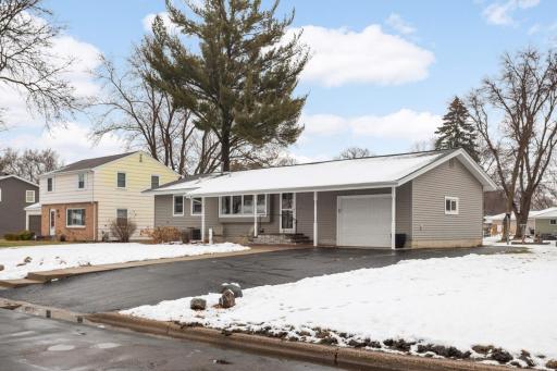 Great lot with sidewalk and irrigation -- extra parking on side of insulated garage.