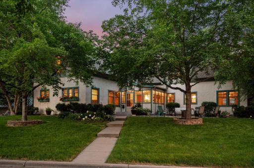 Welcome to 1407 Midway Parkway—where lush greenery and thoughtfully designed landscaping enhance the home's charming curb appeal.