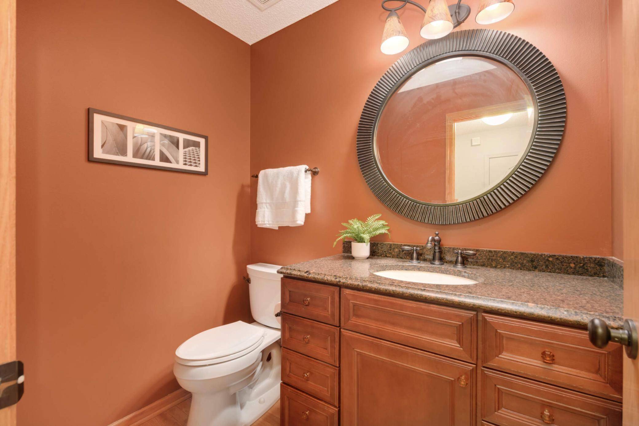Beautiful main floor bathroom with large vanity, nice lighting.