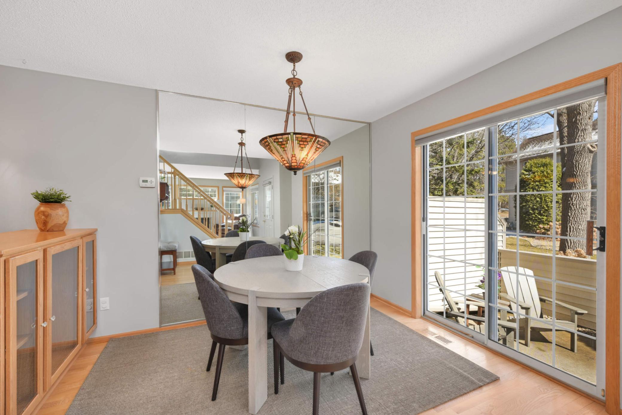 Nice dining space opens up to a great patio door and space for grilling those steaks!
