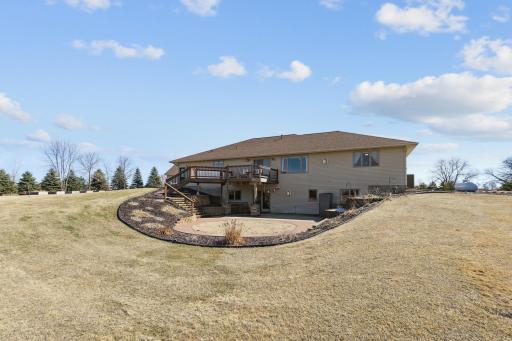 Back of the home. Great deck, fabulous landscaping and a huge backyard for the kids or dogs to run and play! Outdoor hobbies? There is so much room to enjoy here! New roof 2022!