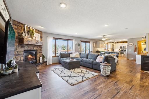 Step inside and feel immediately at home. The main level features a gorgeous living room with rich flooring, warm paint colors and fantastic windows!