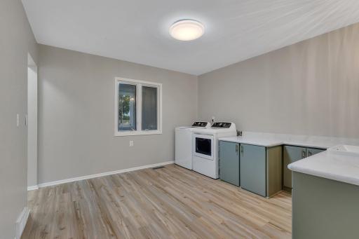 Main floor laundry room! Can also be used for home business, hobby room, kids craft room, exercise room...
