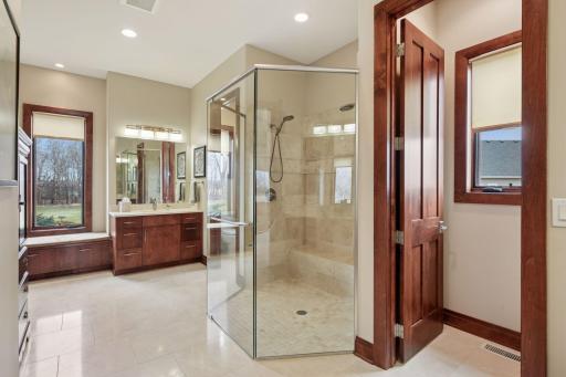 Primary bath features separate toilet rooms and separate vanities.