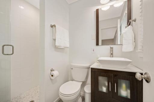 Remodeled primary 3/4 bath with a vessel sink.
