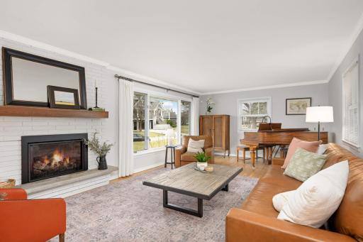 Great room with a gas flpc and a large picture window