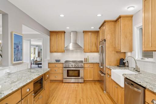 There is an abundance of custom kitchen cabinets and premium stainless steel appliances.