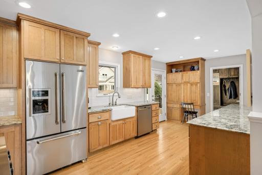 An amazing amount of granite countertops, white subway tile backsplash and a farm sink