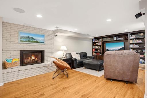 A 2nd gas fplc and a wall of built-ins in the family room area.