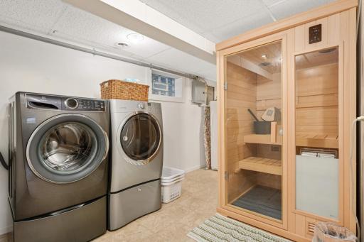The finished Laundry room has storage and negotiable sauna