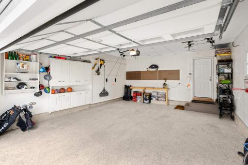 The garage is finished and hase epoxy floor and storage cabinets