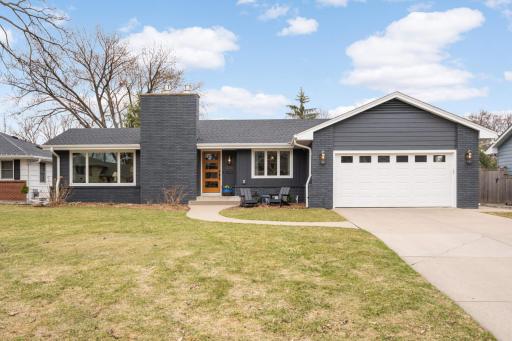 Great curb appeal, concrete driveway and new WIFI Sprinkler syst