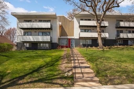 Welcome home! 1261 Cleveland Ave N #8A! Nestled in a prime location, this striking modern building, designed by esteemed Close Architects!