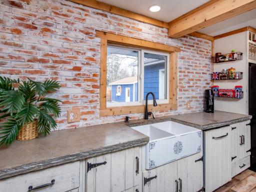 Kitchen with farm sink and concrete c-top